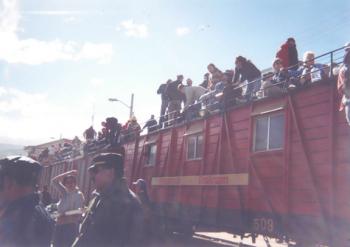 Tourists atop an antique train for a cliff-hanging and spectacularly scenic ride to El Nariz del Diablo in Ecuador (January 2007). Photo by Marsha Mittman